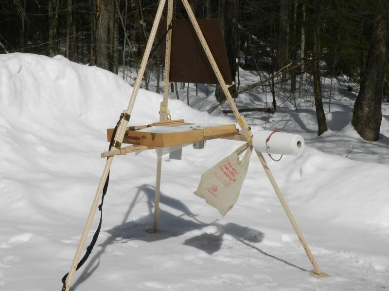 Barbara Carr painting in the snow en plain air with her Take It Easel.  The Take it easel supports her artwork and all her art supplies.